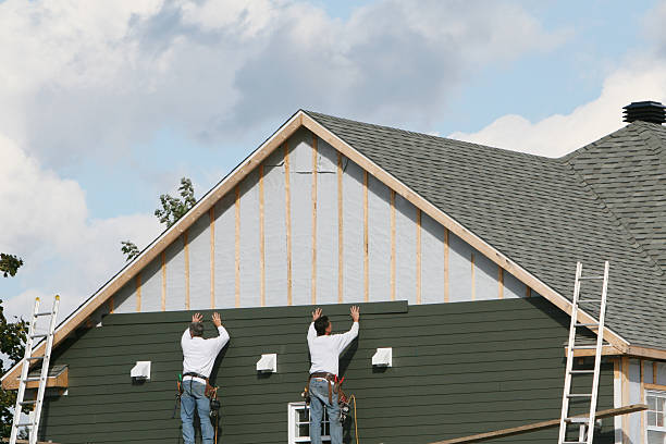 Professional Storm Damage Siding Repair technician working in Lumberville, PA